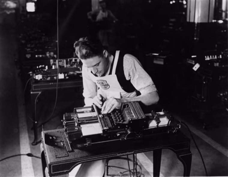 In this undated photo provided by International Business Machines Corp. (IBM) a punch card machine is being assembled. IBM was formed on June 16, 1911, as the Computing Tabulating Recording Co. in a merger of four separate companies. The new business with a plant in Endicott, N.Y., made scales, time clocks, cheese slicers and _ significantly for its future _ machines that read data stored on punch cards.(AP Photo/IBM Corporation)
